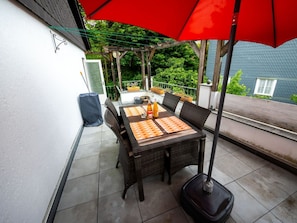 Plant, Umbrella, Building, Shade, Outdoor Furniture, Table, House, Tree, Wood, Chair