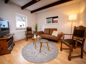 Furniture, Property, Picture Frame, Comfort, Wood, Houseplant, Television, Interior Design, Lighting, Living Room