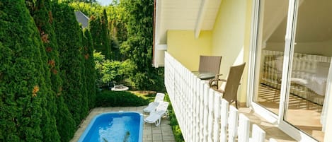 Plant, Property, Building, Sky, Azure, Shade, Yellow, Interior Design, Wood, Cottage