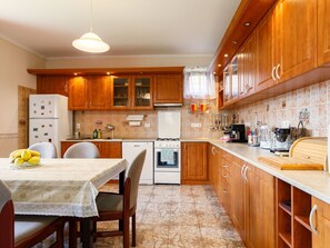 Countertop, Cabinetry, Furniture, Property, Kitchen, Wood, Orange, Flooring, Kitchen Appliance, Floor
