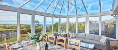 Seawynds, Trelights. Ground floor: Conservatory with views overlooking the garden and distant sea views