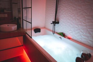 Hydromassage bathtub in the bathroom.