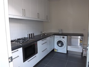 Fully equipped kitchen including washing machine