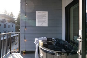 Deck and 2-person hot tub overlooking the courtyard