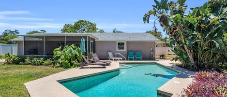 Relax Poolside in the Chaise Lounge Chairs and Umbrella