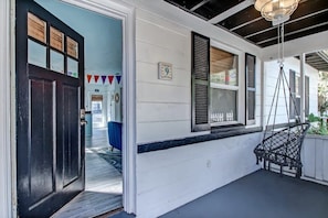Entry via screened in swing porch!