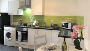 Kitchen - Fully equipped kitchen with oven, hob, fridge freezer, microwave and washer dryer