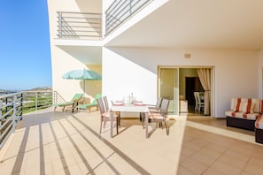 All patios are equipped with dining tables, parasol and 2 long chairs.