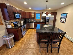 Fully Equipped Kitchen: Modern appliances, ample counter space, and an open-concept design make meal prep a breeze.