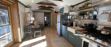 View of the living room and fully equipped kitchen & king bedroom.