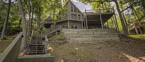 A view of your imposing and inviting luxury house by the lake