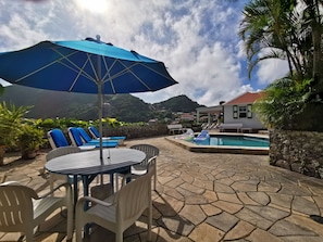 Outdoor patio / Dining area with the pool.
