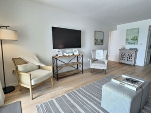 Living room featuring a new smart tv. 