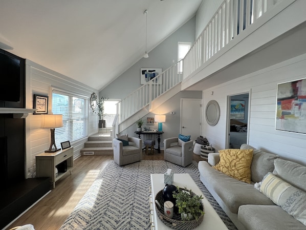 Open floor plan adjacent to dining room and kitchen.