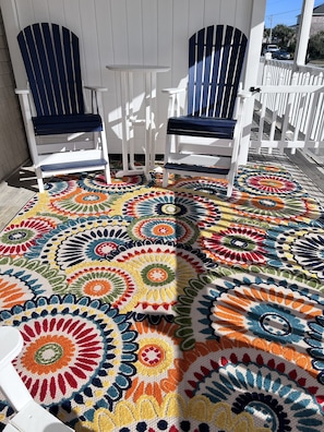 Cozy sitting area on covered front balcony