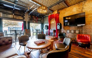 The speakeasy lounge awaits you.  Open the garage doors in beautiful weather so the passer buyers can applaud your karaoke magic!