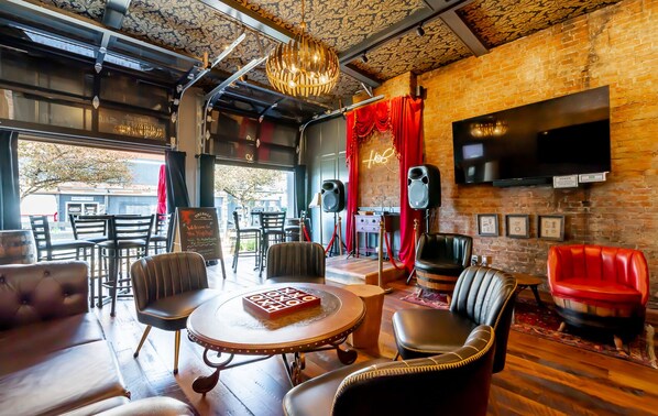 The speakeasy lounge awaits you.  Open the garage doors in beautiful weather so the passer buyers can applaud your karaoke magic!