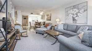 Living room has a fold-out, queen-sized sleeper-sofa.