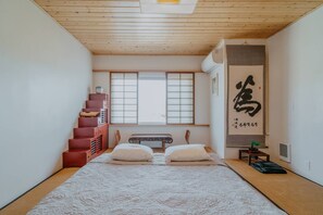 Japanese futon on top of a foldable mattress
