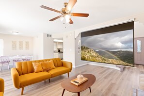 Living Room: Oversized projector screen with free streaming contents to watch