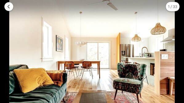 Spacious living room/dining open floor plan, looks out onto deck and beyond...