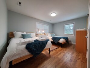 Upstairs bedroom with two queen beds.