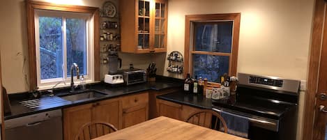 Kitchen table, new induction stove, soapstone counters, vitamix