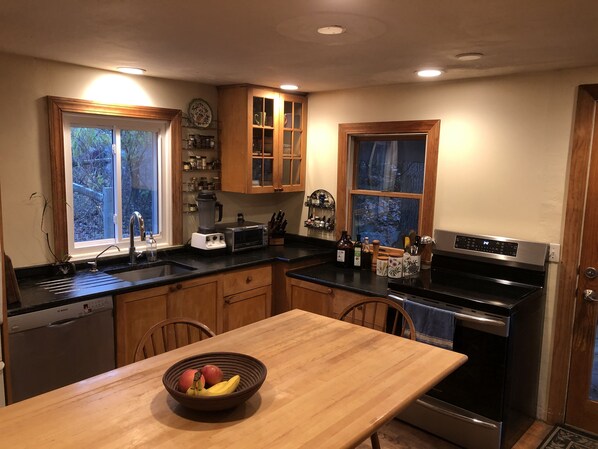 Kitchen table, new induction stove, soapstone counters, vitamix