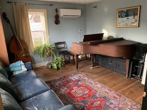 Music, blue room with baby grand piano, upright bass  