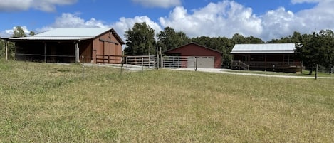 House, garage, and barn from west-side pasture. Easy turn-around for trailers.