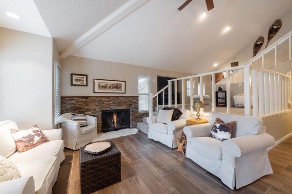 Lower living area with fireplace.