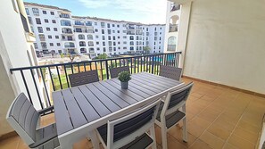 Spacious balcony with separate access from both living room and kitchen.