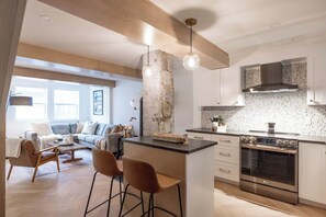 Open sight lines from the kitchen to the living room are ideal for entertaining