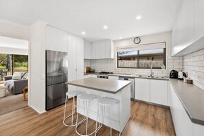 The breakfast bar is perfect for quick meals or a casual coffee break