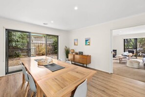 Perfectly blending modern amenities with retro charm, this spacious home has easy flow from dining through to the living area and backyard