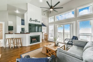 Living Room w/ views! Opens up to patio area with seating to take in the view. 