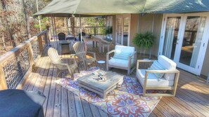 The Clearwater Glamp Deck has plenty of living & dining space & a hot tub.

