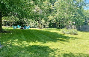 Large back yard with fire pit!  We sit on 1/2 an acre of land.