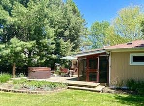 Back deck with hot tub and screened porch.