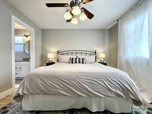 Master Suite with a King sized bed and a private bathroom