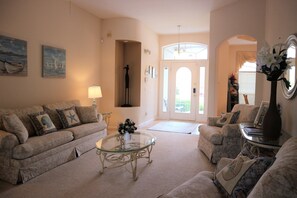 More formal living room as entering the villa. 