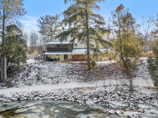 View of the back of the house from across the brook
