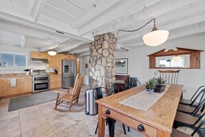 Kitchen with antique farm table large enough for 10