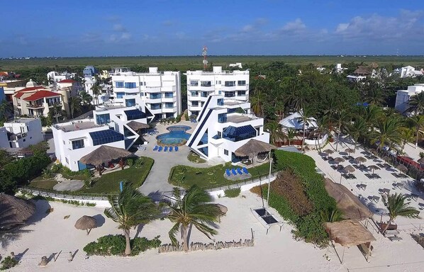 Aerial view of the complex and the mangroves -- the sand in front is the beach!