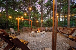 Outdoor firepit to gather with friends, family, roast smores, swing and tell tall tales