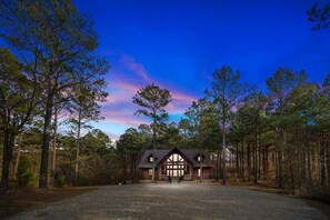 Iron Horse Lodge is on a secluded two acre corner lot with tall pine trees surrounding the cabin