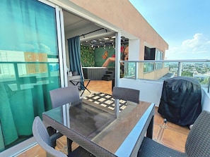 3rd lvl: private terrace with dining area, and BBQ next to living and jacuzzi.