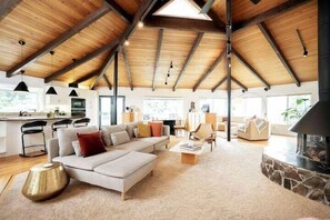 Open floor layout, with open beams and stunning mid century modern vibes