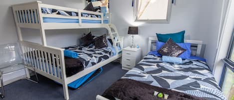 Bedroom 2 - Sleeps 4 (Tri-Bunk & King Single Bed) with wall mounted TV.