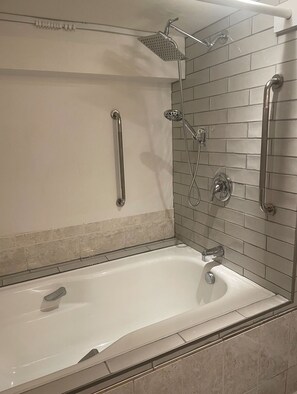 There are two handles for helping you to get in to shower with a big bathtub.